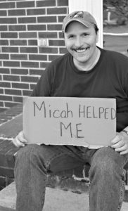 Man holding sign