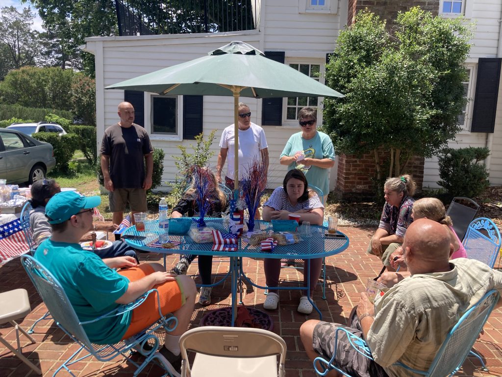 Outdoor gathering at Berclair supportive housing community.